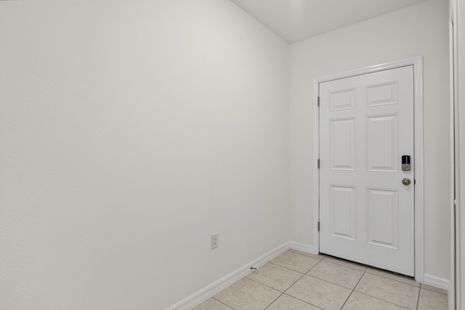 Original: the same entry, an empty hallway facing the front door